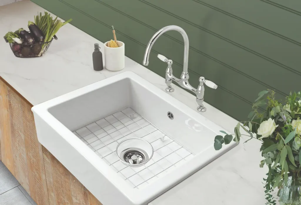 White kitchen sink and marbled worktop