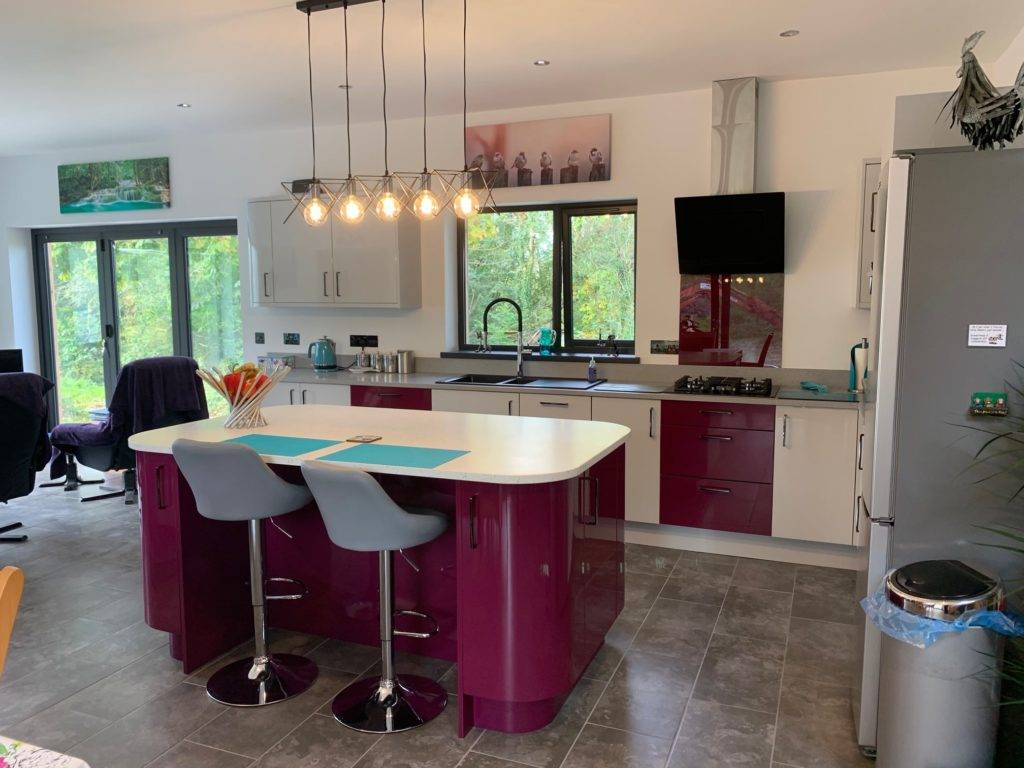 Kitchen with white and purple cupboards